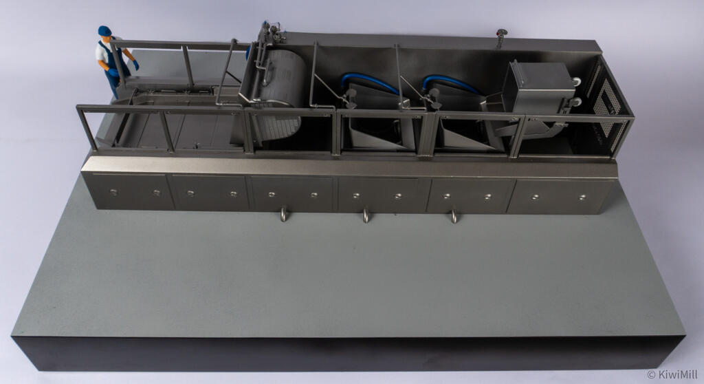 Overhead front view of the cooking line model with grates off, the full row of open tank sections visible